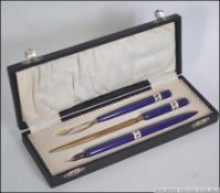 A vintage 20th century cased ceramic handled desk set consisting of Ink pen,