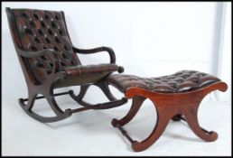 A Regency style mahogany leather button back rocking armchair and ottoman stool.