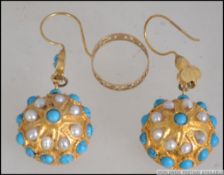 A pair of turquoise and cultured pearl 19th century earrings set upon a gilt metal background along