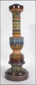 An early 20th century large Doulton Lambeth stoneware candlestick of geometric design with single