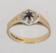 A vintage hallmarked Birmingham 9ct gold ring with central sapphire surrounded by diamonds in a