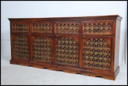 A stunning large arabic sheesham and brass sideboard dresser.