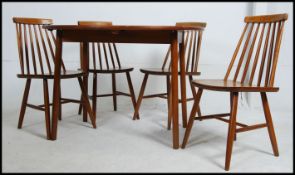 A mid 20th century vintage / retro Dinette drop leaf dining table with a group of four Ercol style