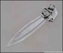 A silver bookmark with a cat and a fish bowl to the stem. Marked 925. Weight 6.8g.