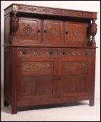 A Victorian Maple & Co carved oak court cupboard sideboard.