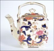 A Masons Ironstone Mandalay large teapot of square form with blue handle complete with lid being