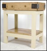 A 20th century upcycled 20th century metal bound beech butchers block,