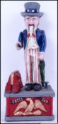 A cast iron, mechanical bank of America's Uncle Sam standing on a podium. 26cm long.