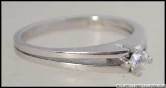 A 14ct white gold single stone ladies diamond ring.
