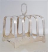 A silver hallmarked toast rack by Mappin & Webb. Hallmarked for Sheffield 1954. Weight 91.6g.