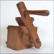An early 20th century beechwood French farmhouse buckwheat meal grinder of large form .