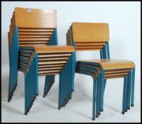 A set of twelve vintage industrial mid 20th century church / village hall stacking chairs.