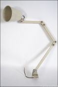 An early 20th century industrial wall mounted adjustable Memlite anglepoise light,