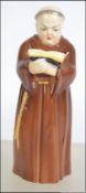 A Royal Worcester ' Monk ' Candle Snuffer bearing black Worcester stamp. Measures 13cm high.