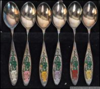 A cased set of 6 silver & enamel hallmarked spoons complete in the presentation box.