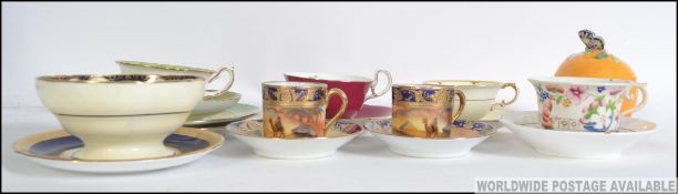 A collection of Bone China tea cups and coffee cans to include Aynsley, Paragon, Hammersley and Co,