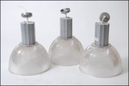 A set of contemporary factory pendant lights by Compact Lighting ) model no 550047J/X5501 ,