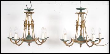 A pair of unusual mid century Empire style brass 5 branch swag ceiling lights - chandeliers dating