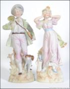 A Pair of Continental bisque figurines dating to the early 20th century.