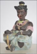 An unusual late 19th century continental / German bisque porcelain novelty nodding head doll in the