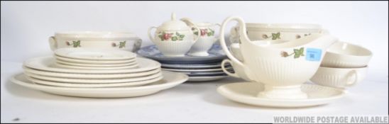 A Wedgwood Moss Rose No T432 pattern part dinner service to include gravy boat, tureen,