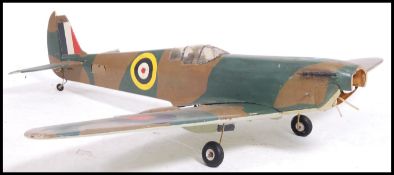 A large vintage scratch built balsa wood constructed remote controlled Spitfire aeroplane.