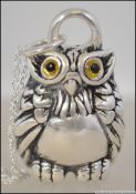 A silver plated pendant necklace in the form of a large lucky owl. Set to a silver 925 chain.