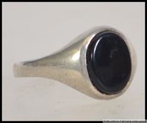 A white metal silver ladies jewellery mourning ring. Ring size O.