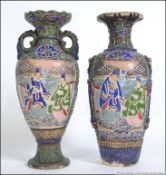A pair of early 20th century oriental Japanese Satsuma ware vases.