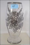 A 20th century glass vase having silver overlay.