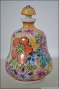 A Chinese famille rose porcelain perfume bottle of bulbous form with character marks to the base (