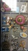 A stunning collection of vintage and antique costume jewellery to include brooches, belt buckles,