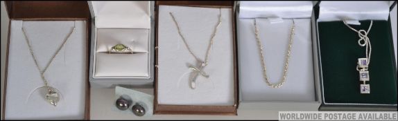 A collection off silver jewellery items to include five cased silver necklaces, three with pendants,
