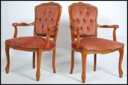 A pair of 20th century French fauteuils in beechwood having shaped show wood frames upholstered in