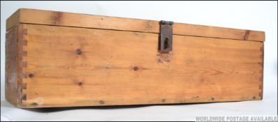 A 20th century pine workbox with two sectional lift out trays to the interior.