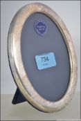 A cased Sterling silver hallmarked picture / photo frame with velour easel back complete in the