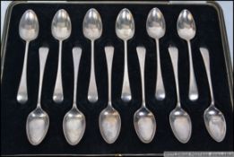 A cased set of 12 silver hallmarked spoons complete in the presentation box.