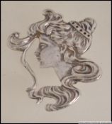 An early 20th century silver belle Epoque ladies brooch in the form of a maiden being hallmarked