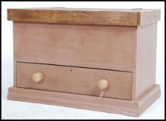 A Victorian style painted reproduction pine blanket box having plinth base with hinged waxed top