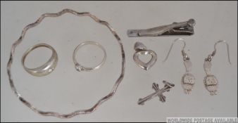 A collection of silver jewellery to include drop earrings, cz inset star ring, 925 marked ring,