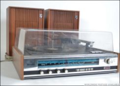 A Philips record player and radio system along with a pair of Philips speakers