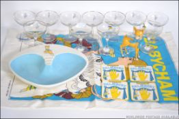 A collection of Babycham advertising glasses ( yellow & White faun ) together with a Babycham