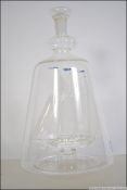 A blown glass 20th century ship in a bottle having inset ship Sir Winston Churchill and set to a