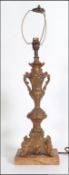 A decorative vintage rococo style Victorian brass table lamp base. Measures 64cm high.