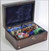 A good collection of costume/dress jewellery held within a rosewood mother of pearl inlaid