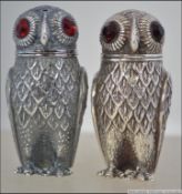 A pair of continental silver 800 marked condiments - salt and pepper pots in the form of a pair of