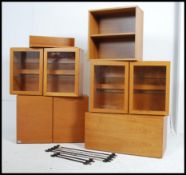 A retro 1970s Beaver & Tapley modular shelving system comprising of a selection of wall mounted