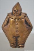 An unusual 20th century brass vesta case in the form of a clown - pierrot. With hinged top.