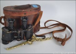 A pair of mid century Dolland military issue leather cased binoculars together with an Edwardian