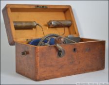 A vintage early 20th century circa 1920's oak cased Quack home medical electro magnetic machine.